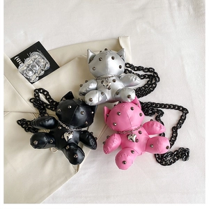 Detail of creative cat-shaped crossbody bags with metal studs and heart charms
