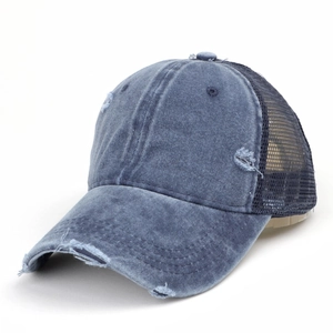 Washed blue denim baseball cap with distressed details and breathable mesh back