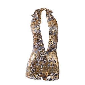 Detail of leopard gold foil halter jumpsuit featuring a deep V-neck and metallic finish