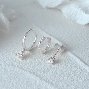 Macro detail of S925 sterling silver evil eye earring set with cubic zirconia stones