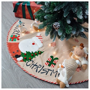 Detailed close-up of Santa Claus linen Christmas tree skirt with Merry Christmas embroidery