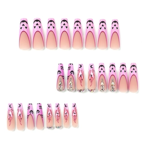 Pink gradient Halloween press on nails with flame, moon, and rhinestones in long coffin shape