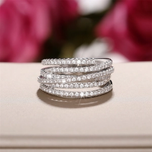 Detailed close-up of a silver multi-layer wrap ring with sparkling pavé-set zircons
