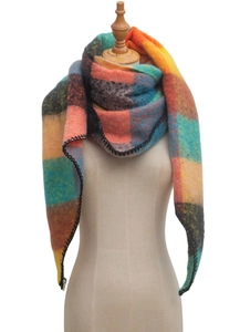 Detailed view of the multi-color plaid textured scarf draped over a wooden neck mannequin