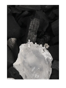 Detail of S925 sterling silver cross earrings with zircon on natural quartz and black stone