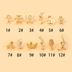 Detailed collection of 12 gold-plated stud earrings with zircon and pearl accents