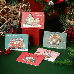 3D pop-up Christmas cards featuring festive illustrations on a dark green background