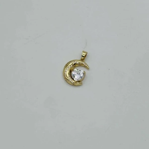 Detailed view of a gold moon and heart pendant accessory inlaid with sparkling zircons