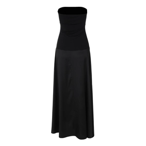 Detail of elegant black strapless dress featuring a knit bodice and satin patchwork skirt