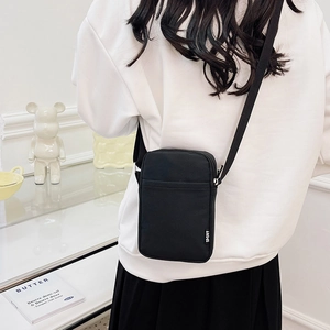 Minimalist black crossbody phone bag with adjustable strap for sports and casual travel