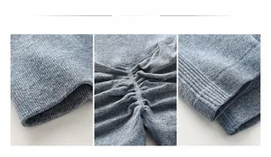 Detail view of heather blue yoga pants showing ruched seam and ribbed knit fabric texture