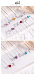 Détail macro de colliers tulipe avec pierres précieuses colorées et feuilles serties de diamants