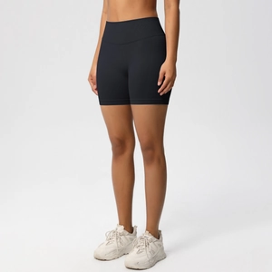 Detail of high-waist seamless compression waistband on black yoga shorts for tummy control