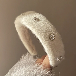White plush headband with sparkling crystals and elegant silver ornaments for women