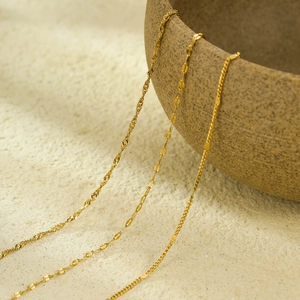 Three-layer 18k gold plated stainless steel necklaces featuring curb and cable chain styles