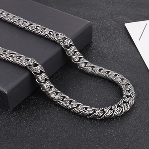 Detailed view of silver punk style braided stainless steel chain necklace for men