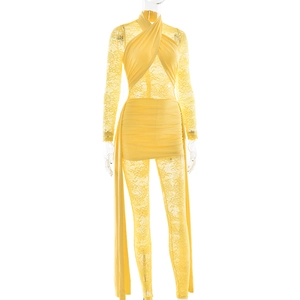 Detailed view of yellow halter neck bodysuit with lace sleeves and floral texture