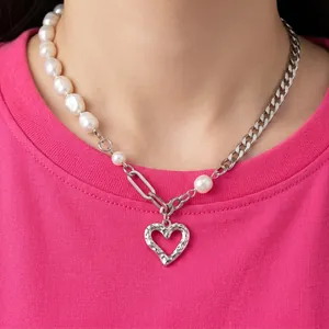 Elegant pearl and silver chain necklace with hollow heart pendant for women