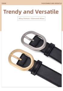 Detail of lychee textured black PU leather belt with matte gold and silver alloy buckles