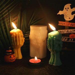 Detailed view of skull hand candles and the 3D silicone mold for Halloween decor