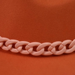 Thick orange wool felt fedora hat featuring a stylish decorative light pink chain detail