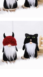 Close-up of plush Halloween gnomes with red horns and black cat hats on wood bases