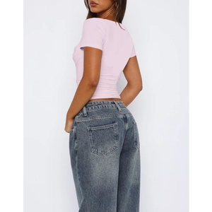 Rear view of a slim-fit pink short-sleeved t-shirt for women with subtle ruched details