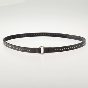 Detail of a dark brown leather cord with gold and silver rivets and a round buckle