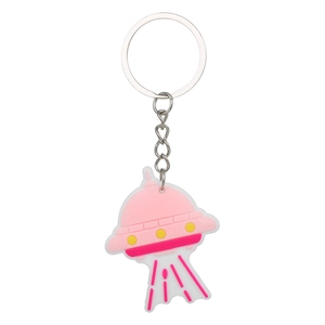Cute pink and white silicone UFO astronaut keychain with metal ring on white background