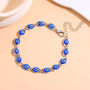 Silver-plated evil eye bracelet with blue resin beads and adjustable lobster clasp