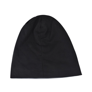 Detail view of the black knit beanie showing the seamless texture and stretchy cotton fabric