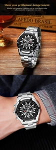 Men's silver steel chronograph watch with black dial and luminous hands on a wrist