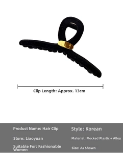 Détail d'une pince à cheveux floquée noire de 13 cm avec décor rectangulaire doré