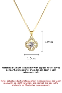 Detail of titanium steel gold necklace featuring a zircon clover pendant with 45cm chain