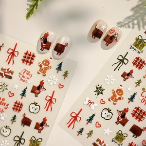 Christmas nail stickers with dachshund, gingerbread man and festive holiday patterns