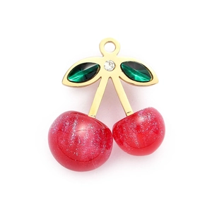 Detail of cherry-shaped pendant with red glitter fruits, green leaves, and gold stems