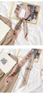 Detail of beige silk scarf with vintage architectural prints shown tied and flat
