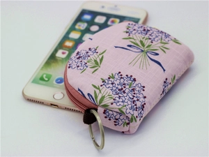 Floral half-round coin purse with pink lavender pattern and metal keychain ring