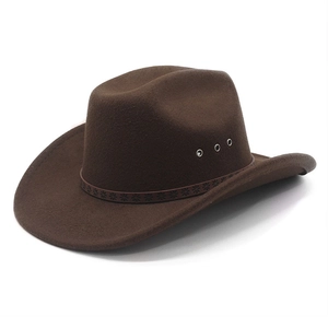 Close-up of brown felt cowboy hat with leather band featuring star patterns and metal eyelets