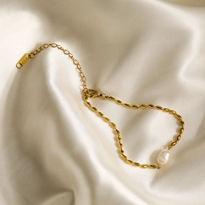 Minimalist 18K gold plated pearl chain necklace with an elegant silk background