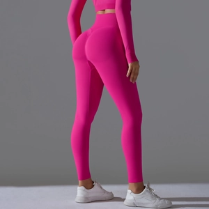 Rear view of high waist rose pink yoga leggings and long sleeve top set for fitness