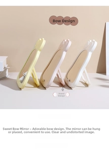 Specchi per trucco a fiocco nei colori rosa, giallo e bianco con supporto pieghevole