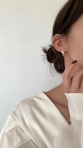 Elegant gold square zircon earrings on model for a minimalist aesthetic look
