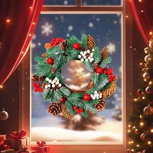 Close-up of a Christmas wreath with pine cones and berries on a snowy window