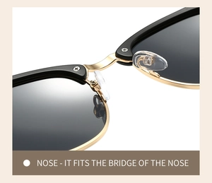 Close-up of golden bridge and soft silicone nose pads on black vintage sunglasses