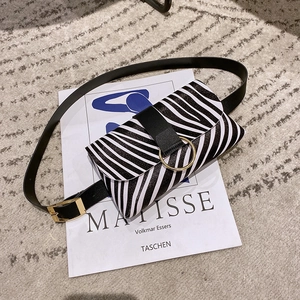 Chic zebra print waist bag with gold circular buckle and black adjustable belt strap