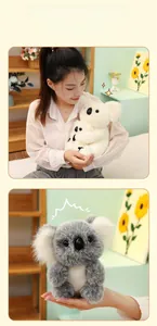 Detail of plush mother and baby koala soft toy showing fluffy texture and soft grey fur