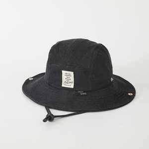 Detail of black denim bucket hat with urban city label and adjustable chin strap cord
