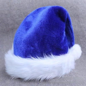 Detail of plush royal blue Christmas hat with soft white faux fur trim and pompom