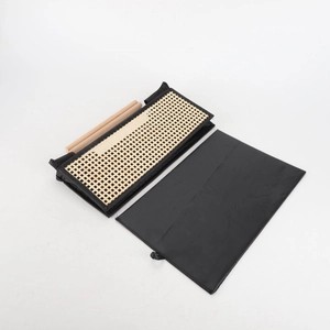 Minimalist black fabric storage bin with rattan panel and natural wooden handles